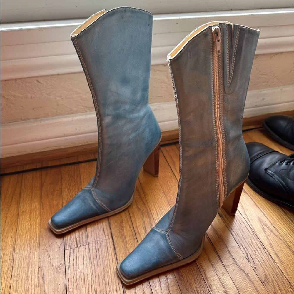 Blue heeled boots with reflective heel